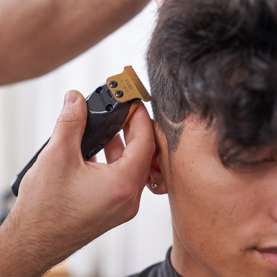 Man having his head shaved